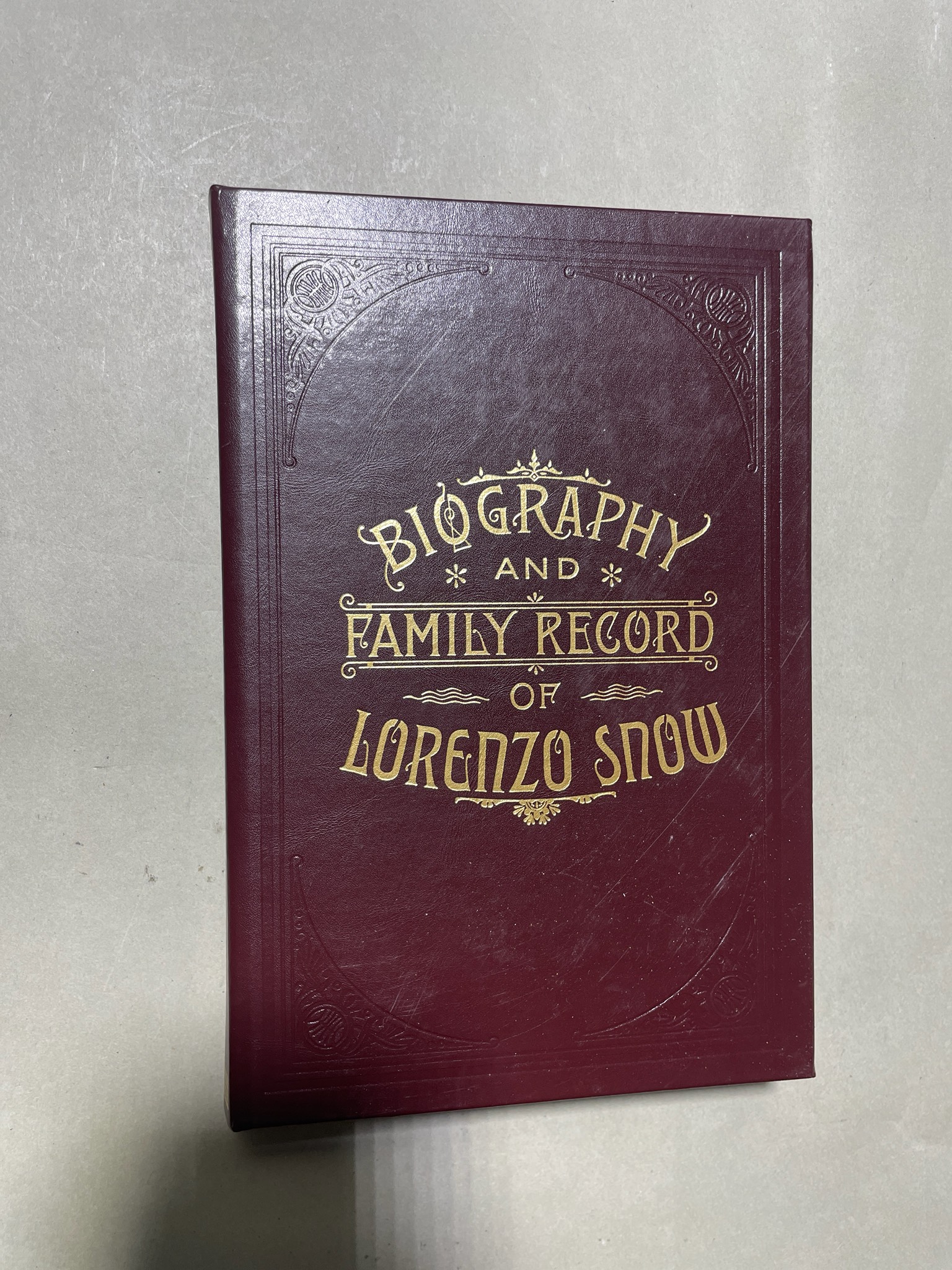 Maroon Embossed Biography
