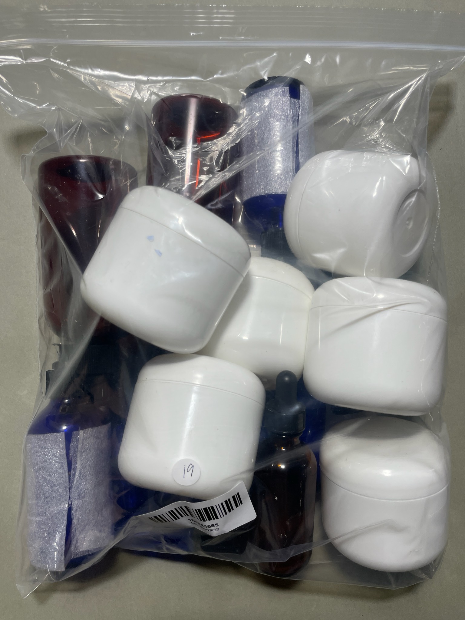 Cobalt Blue and Amber Dropper Bottles and White Sample Jars