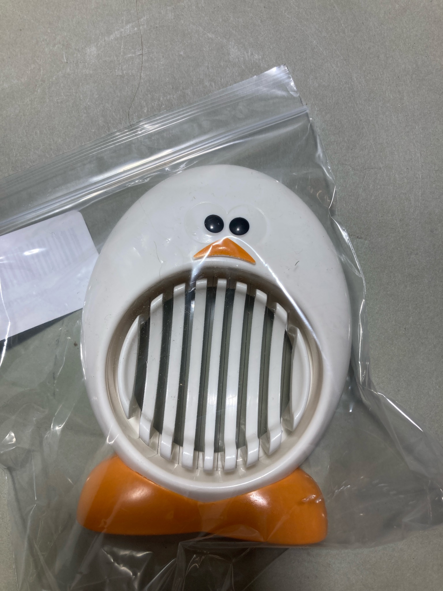 White and Orange Penguin Egg Slicer