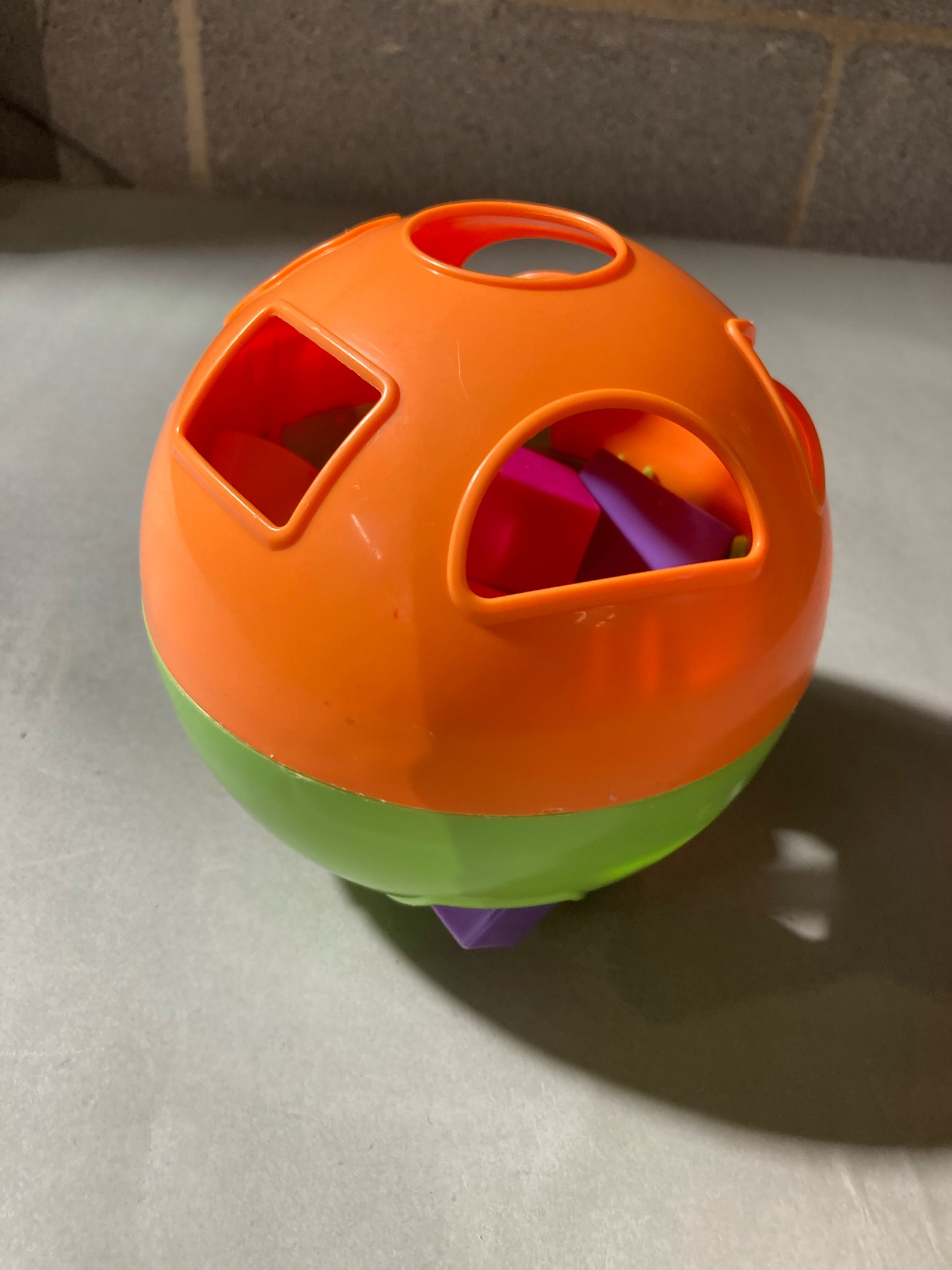 Orange and Green Plastic Shape Sorter Ball