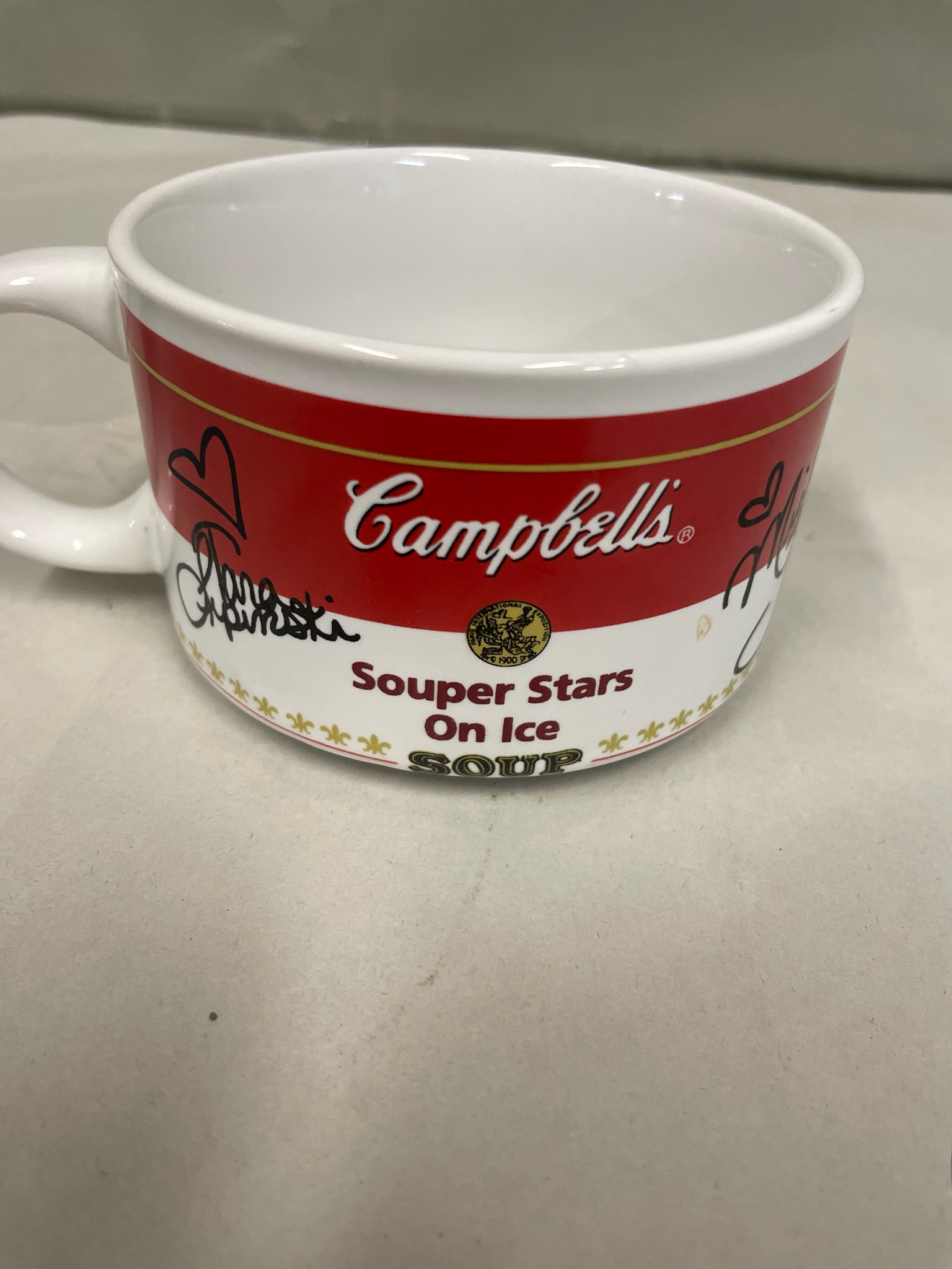 Campbell's soup mug with signatures