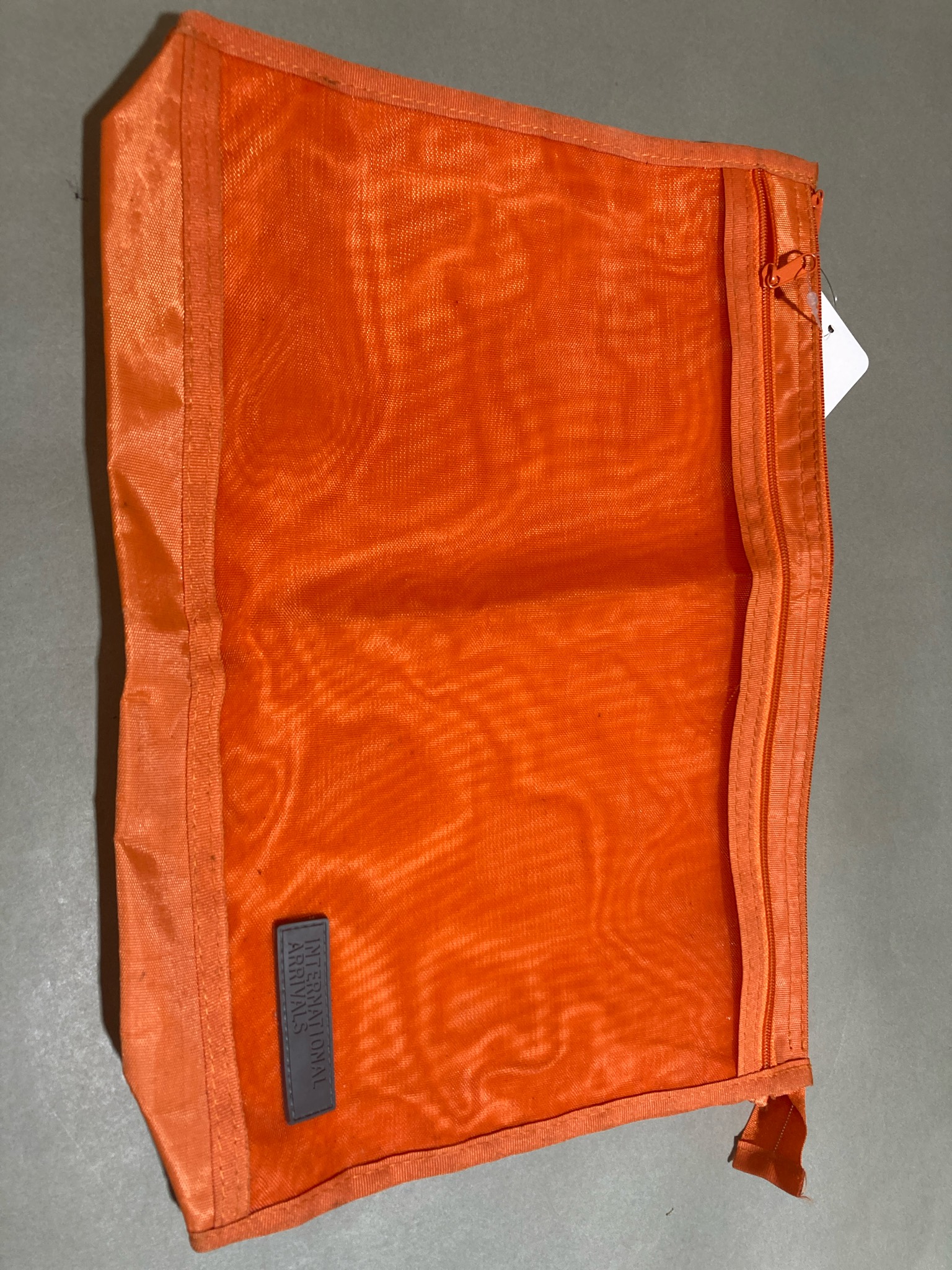 International Arrivals Orange Travel Pouch