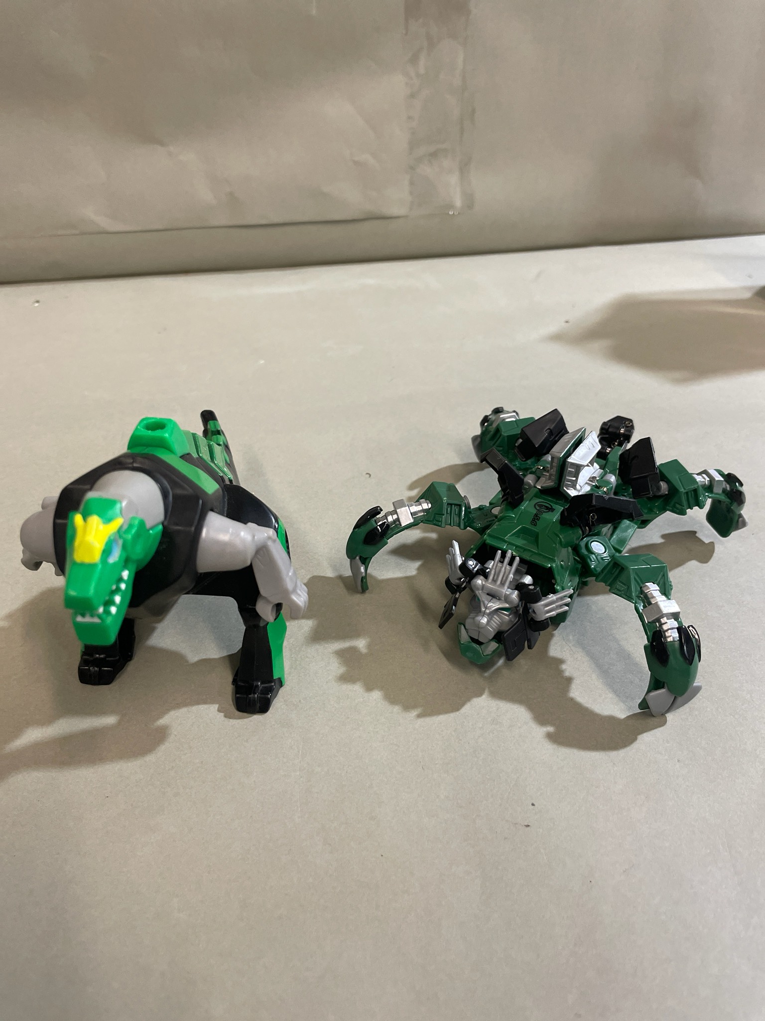Green and Black Transforming Robot Toy Size Small